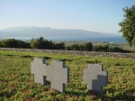 Stone crosses on the hillside among the graves at Maleme